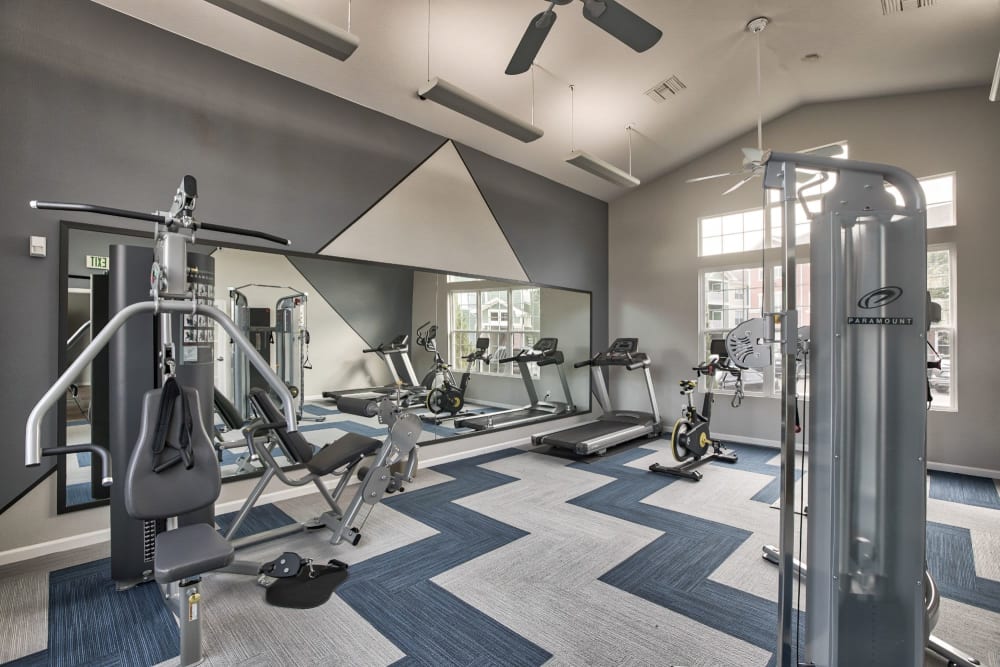 Modern fitness center with plenty of equipment at Westmeadow Peaks Apartments in Colorado Springs, Colorado