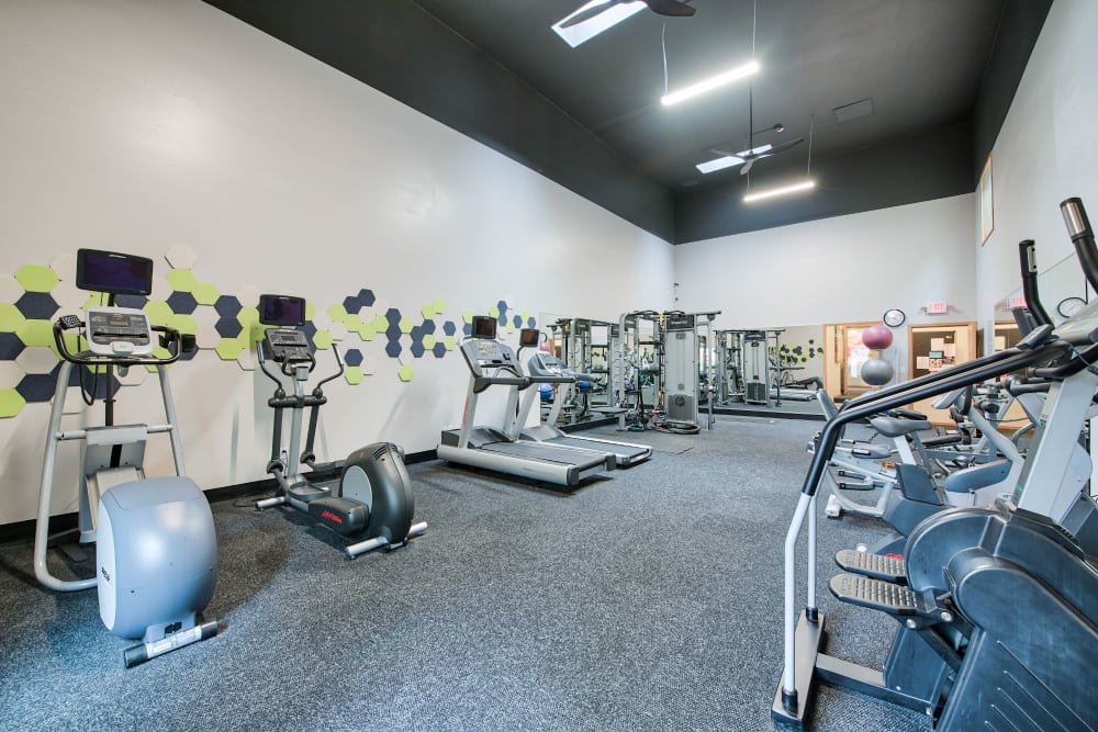 Modern fitness center with plenty of equipment at The Park at Cooper Point Apartments in Olympia, Washington
