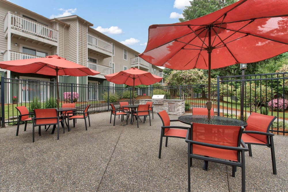 Community picnic area by the pool at The Park at Cooper Point Apartments in Olympia, Washington