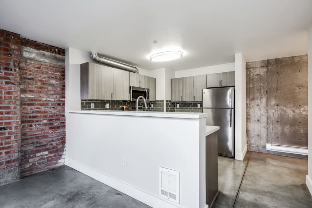 Kitchen area with a big divider into the living room area at Alley South Lake Union in Seattle, Washington