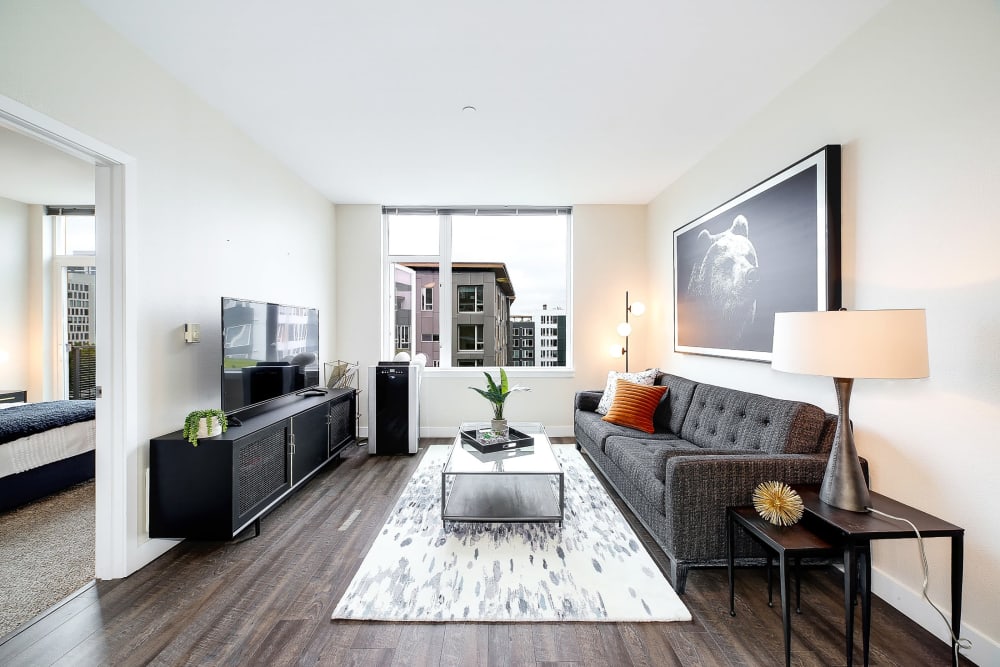 Gorgeous living room in a model home with tons of natural light at Alley South Lake Union in Seattle, Washington