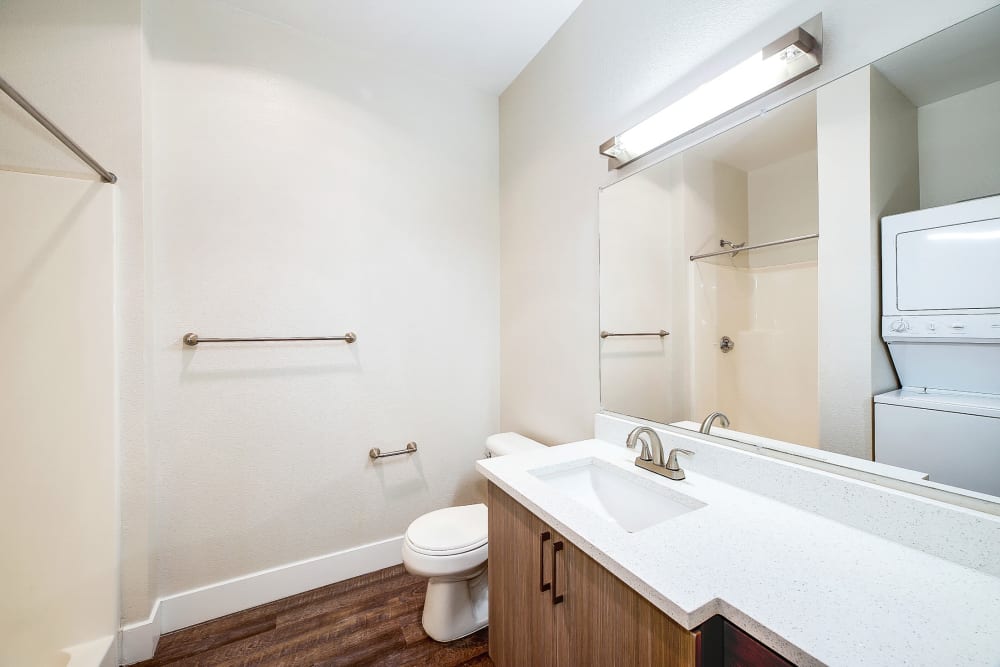 Nice bathroom with large vanity mirror at Alley South Lake Union in Seattle, Washington