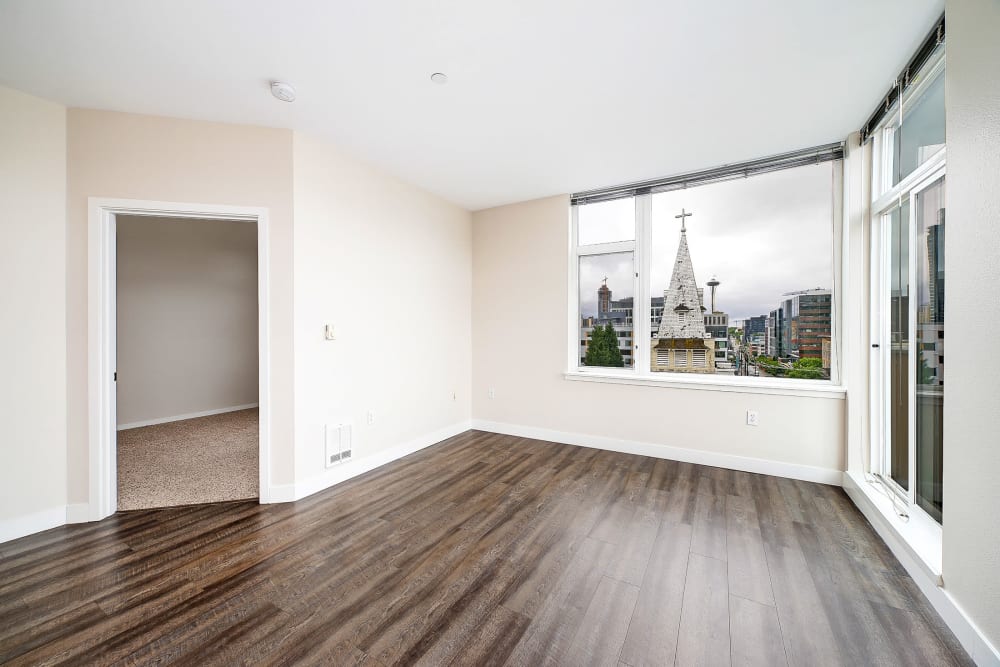 Unfurnished living area with great views from the large windows at Alley South Lake Union in Seattle, Washington