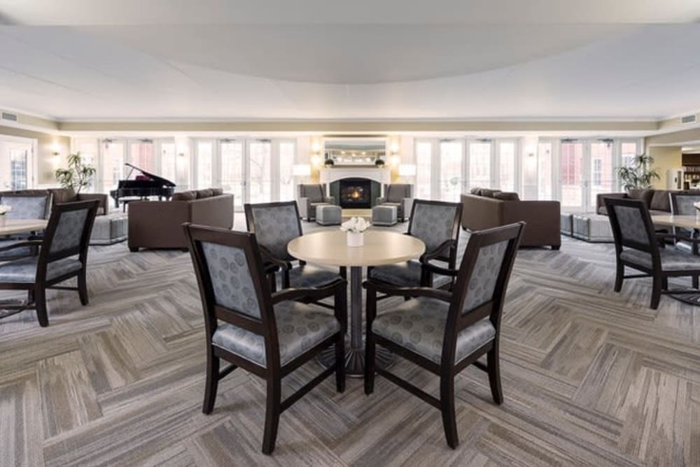 Spacious lobby lounge with fireplace at Hanover Place in Tinley Park, Illinois.