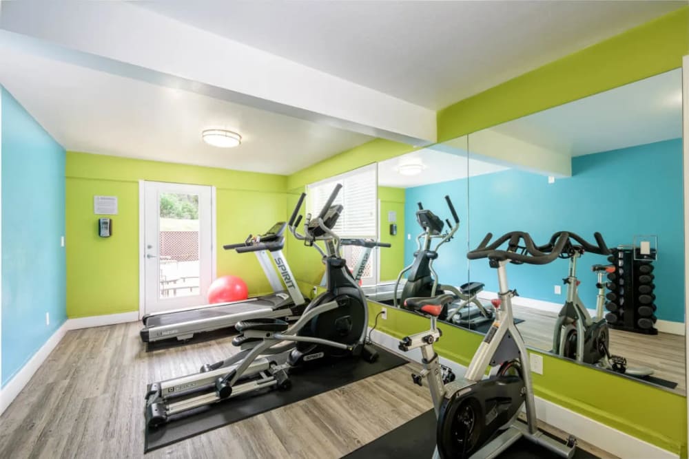 Fitness center with cardio machines for residents to use at Hillside Garden in San Mateo, California