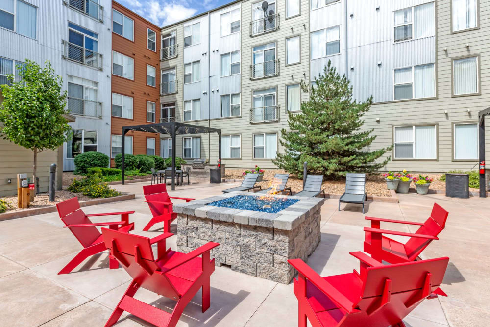 Chairs around a modern firepit at Diamond at Prospect Apartments in Denver, Colorado