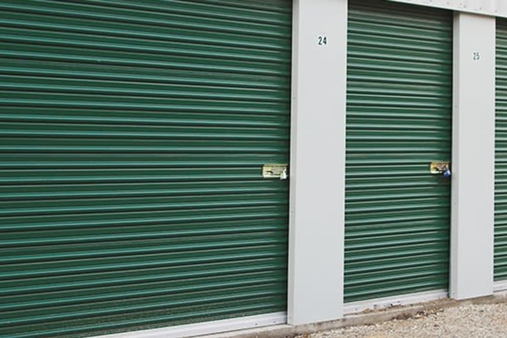 Green doors on outdoor units at American Self Storage – West Pittsboro in Pittsboro, North Carolina