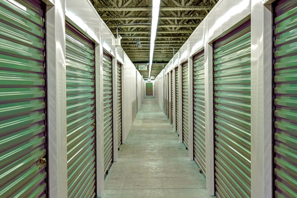 Indoor units with green doors at American Self Storage – East Pittsboro in Pittsboro, North Carolina