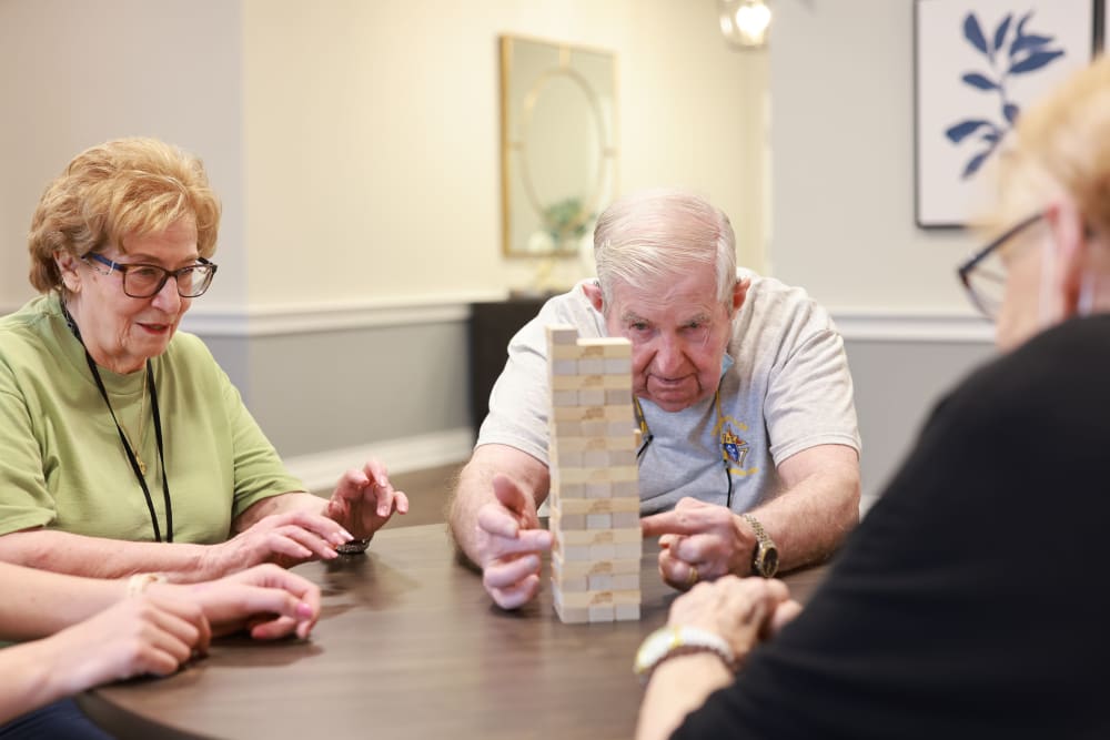Residents playing board games together at The Madison Senior Living in Kansas City, Missouri