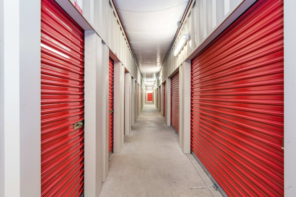 storage untis with orange doors at American Self Storage – Clayton Downtown in Clayton, North Carolina