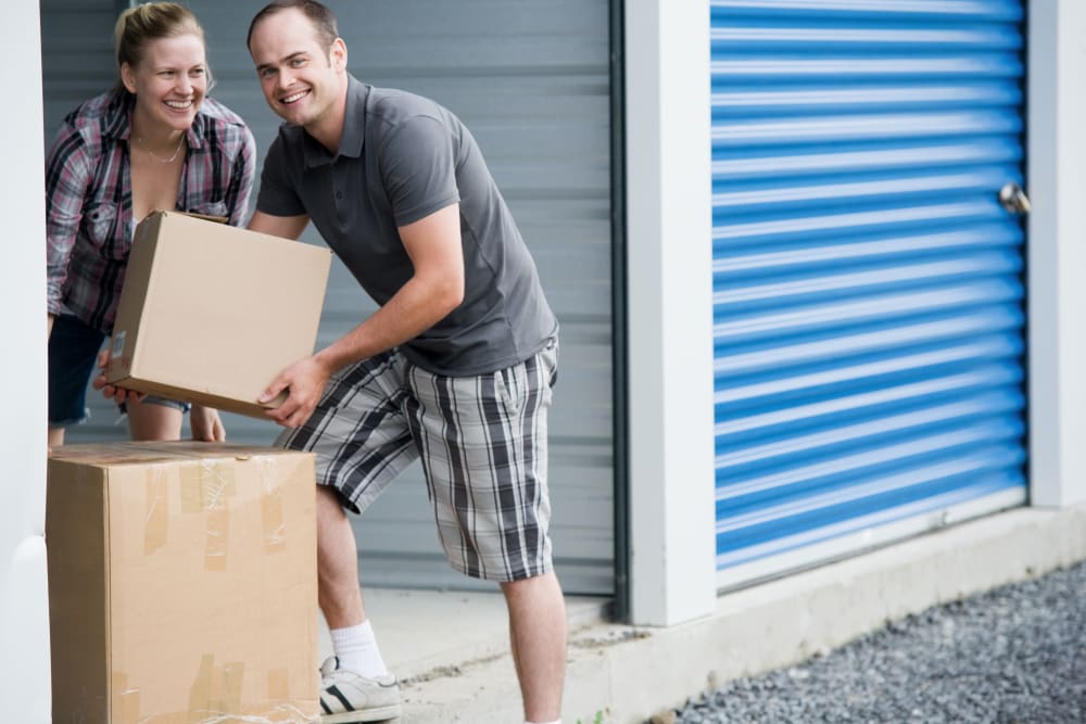 couple packing boxes at American Self Storage – Clayton East in Clayton, North Carolina