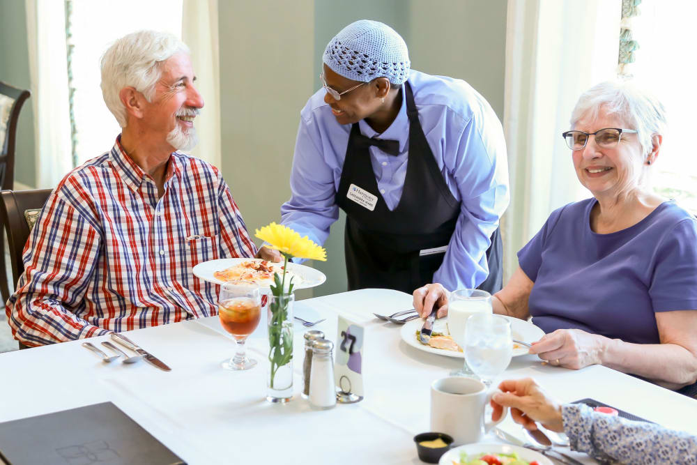 Serving residents a meal at Harmony at Wescott in Summerville, South Carolina