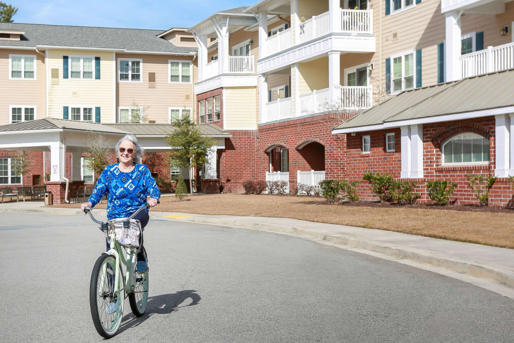 Resident riding bike at Harmony at Wescott in Summerville, South Carolina