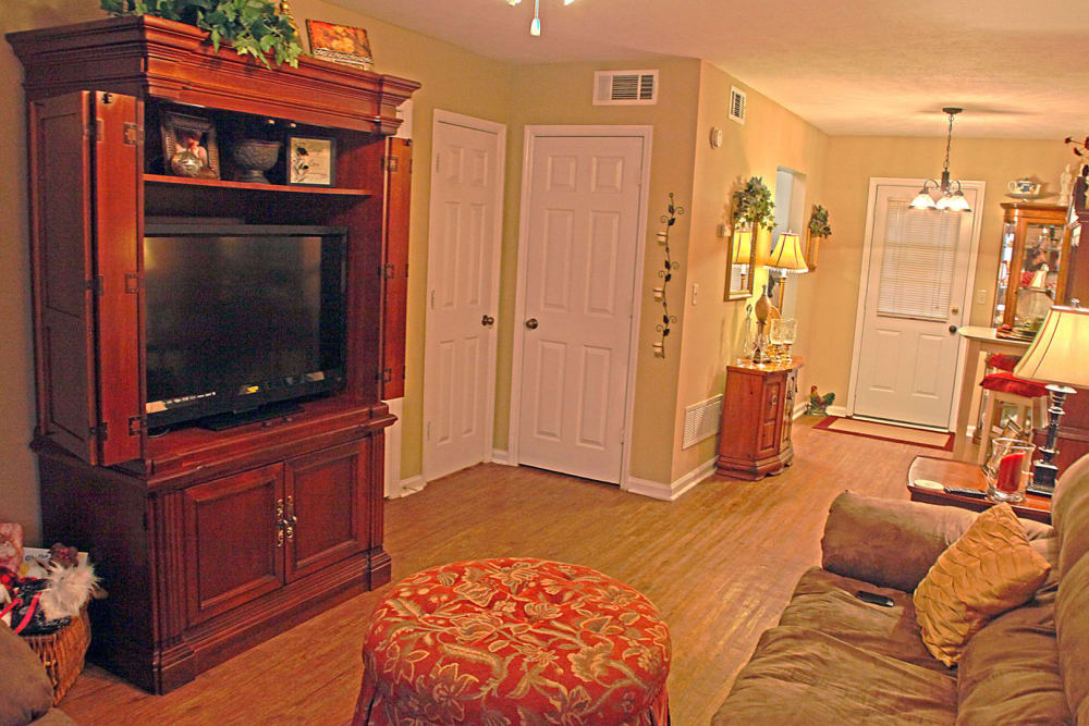 Living room with wood flooring at Northcreek in Phenix City, Alabama