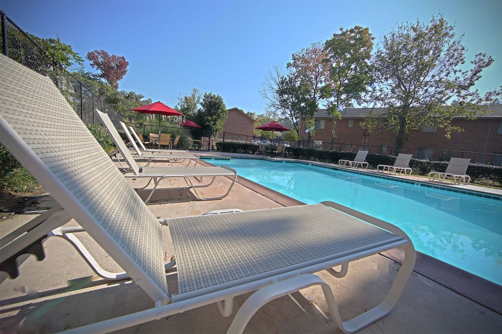 Poolside lounge chairs at Gardenbrook Apartments in Columbus, Georgia