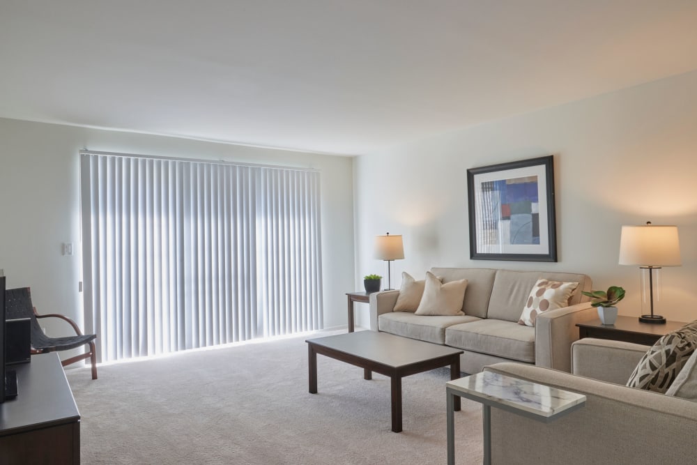Cozy living room with natural window lights at Central Park Estates in Novi, Michigan
