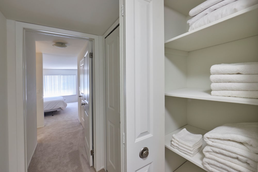 Closet full of linens in model hallway at Town Court in West Bloomfield, Michigan