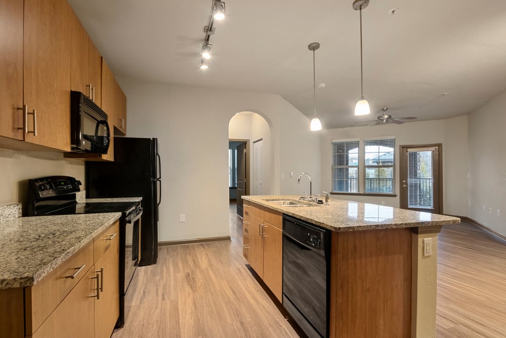Kitchen with island seating at The Addison at South Tryon | Apartments & Townhomes in Charlotte, North Carolina
