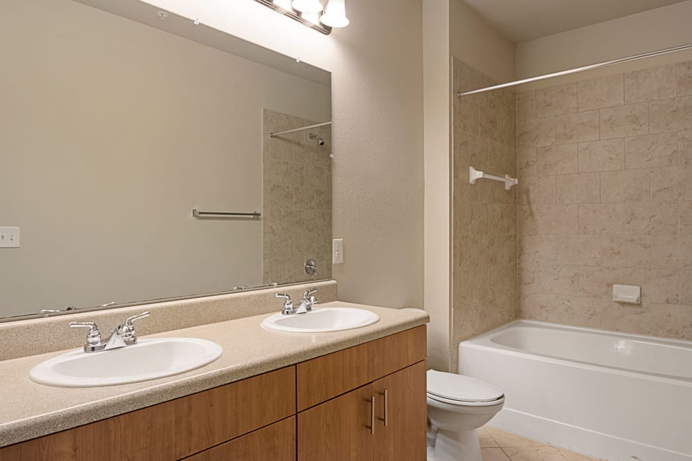 Bathroom with double sinks at The Addison at South Tryon | Apartments & Townhomes in Charlotte, North Carolina