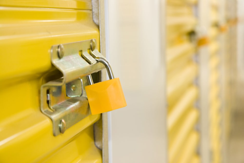 a lock on a yellow unit at Excess Storage Smithfield Road in Knightdale, North Carolina