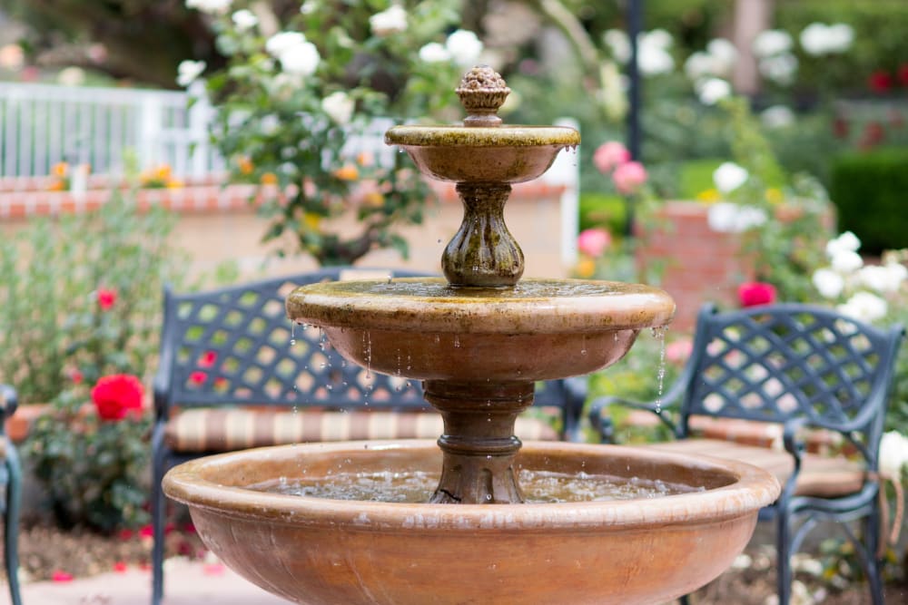 Outdoor seating next to the fountain at Gables of Ojai in Ojai, California