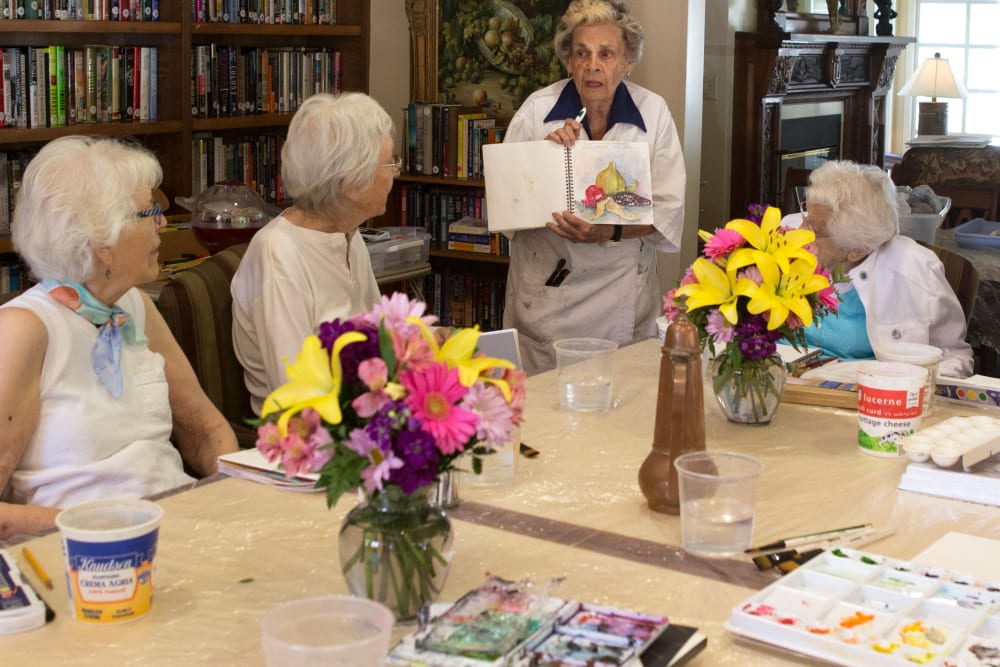 A resident displaying her artwork at Gables of Ojai in Ojai, California