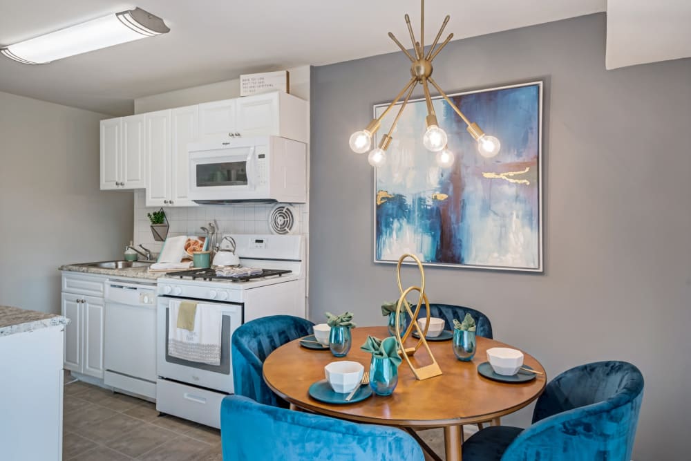 Dining area and open kitchen of a model apartment home at Brookdale at Mark Center Apartment Homes in Alexandria, VA