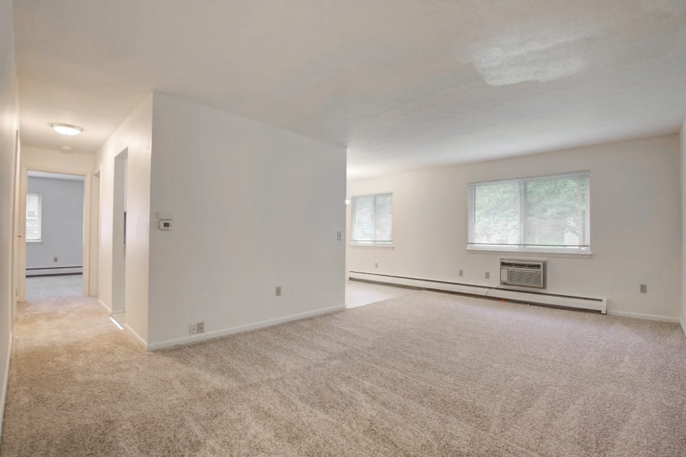 Wall-to-wall carpeting in a home at Knollwood Manor Apartments in Fairport, New York