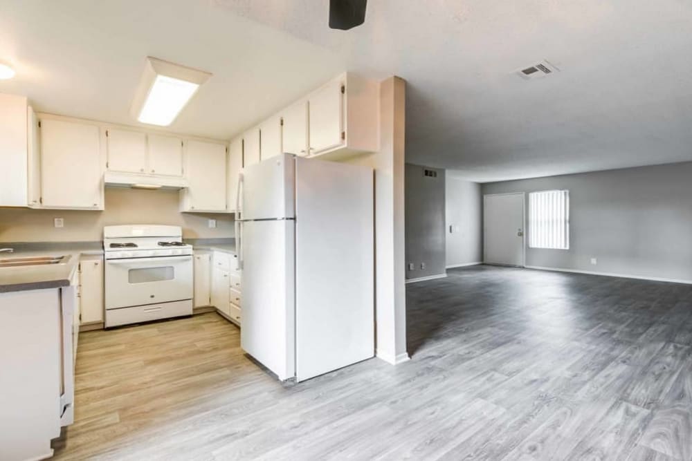 Open concept kitchen and living room area at Sienna Heights Apartments in Lancaster, California
