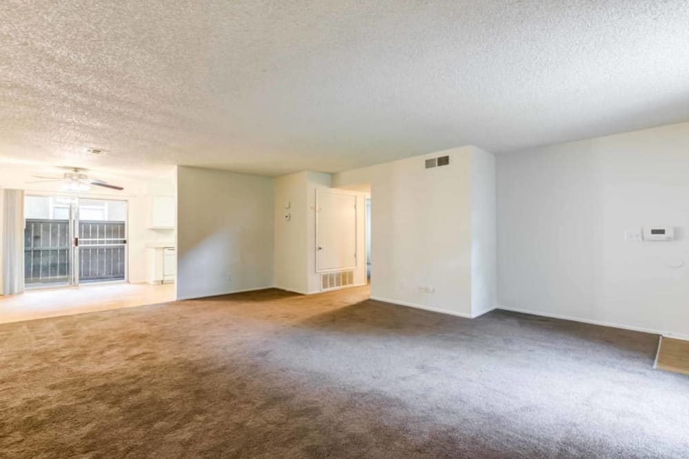 Carpeted living room at Sienna Heights Apartments in Lancaster, California