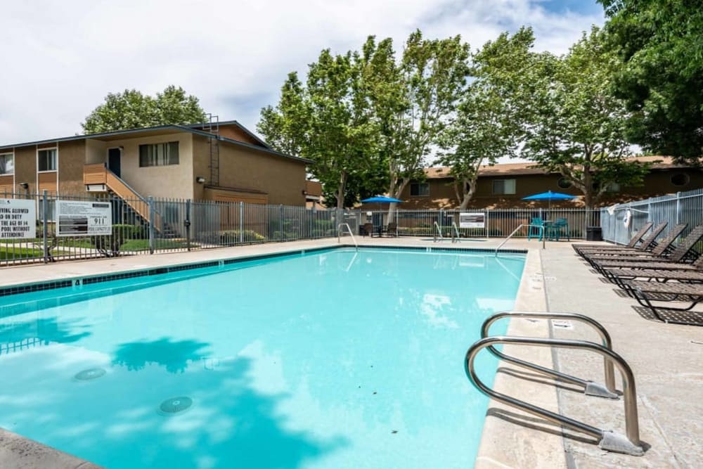 Large in-ground pool at Sienna Heights Apartments in Lancaster, California