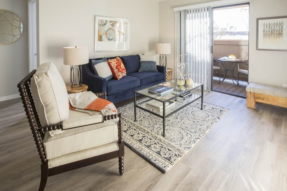 Living room and balcony access at Cassia Apartments in Santa Maria, California