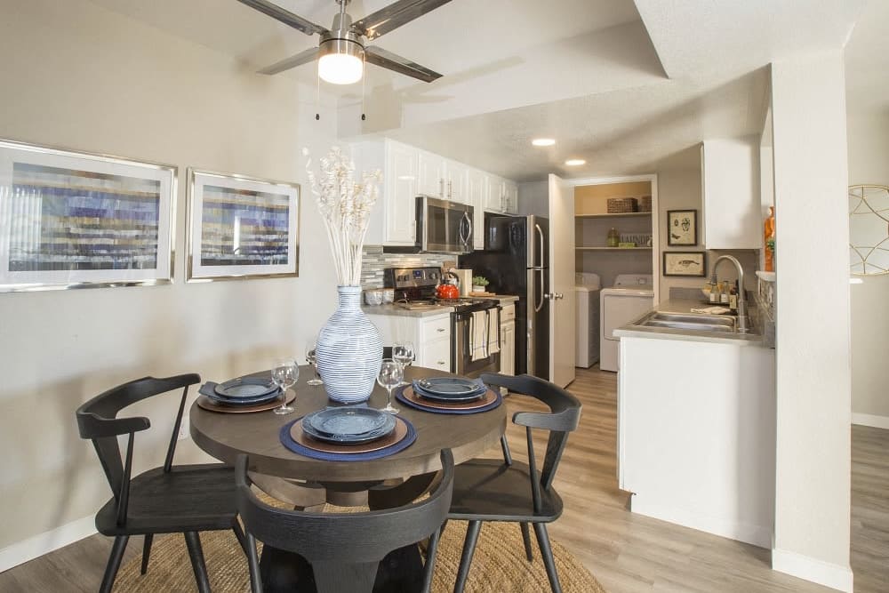 Open dining area and kitchen at Cassia Apartments in Santa Maria, California