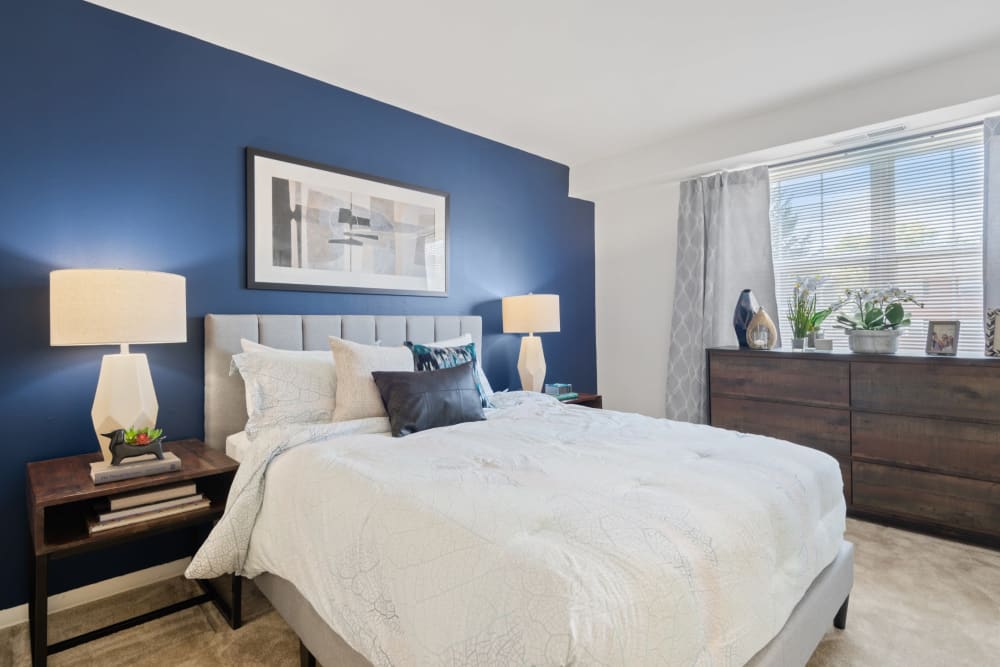 A bright bedroom in a home at Towson Crossing Apartment Homes in Baltimore, Maryland