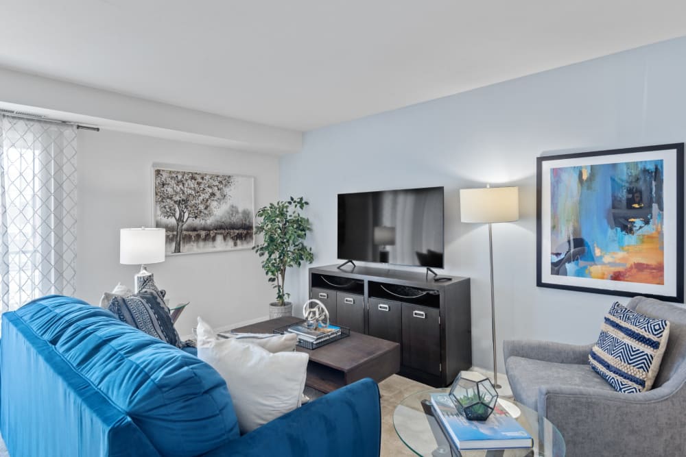 A furnished living room in a home at Towson Crossing Apartment Homes in Baltimore, Maryland