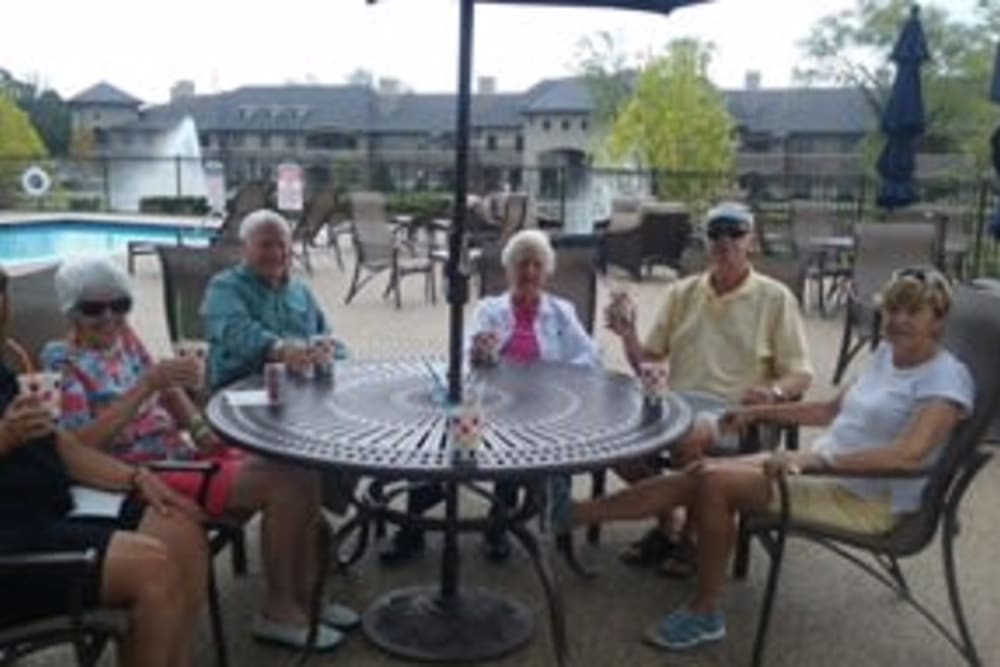 Group of seniors gathered on a summer day at the pool deck at Blossom Ridge in Oakland Charter Township, Michigan