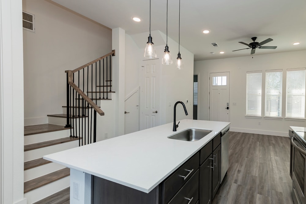Gourmet kitchen with pendant lighting at Elevate at Skyline in McKinney, Texas
