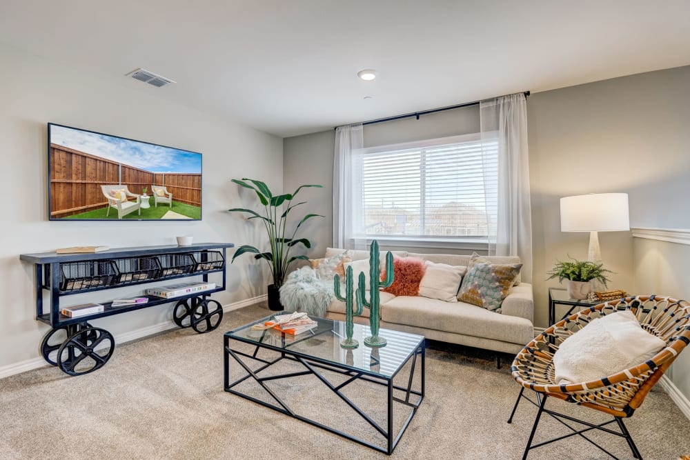 Model living room in a well lit home at Antigua at Lakewood Ranch in Lakewood Ranch, Florida