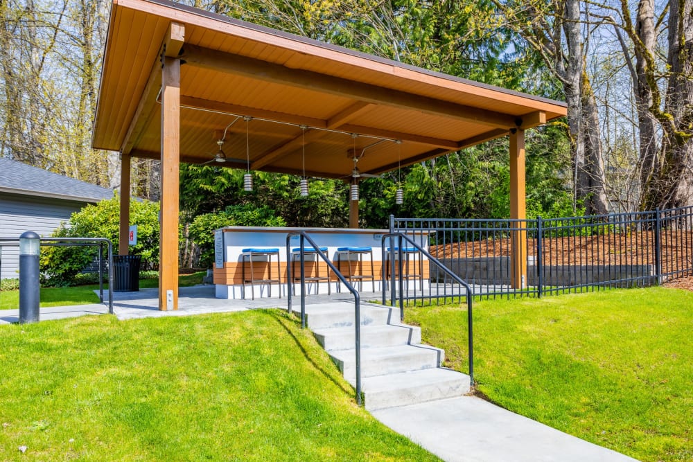 Covered grill and picnic area at Pebble Cove Apartments in Renton, Washington