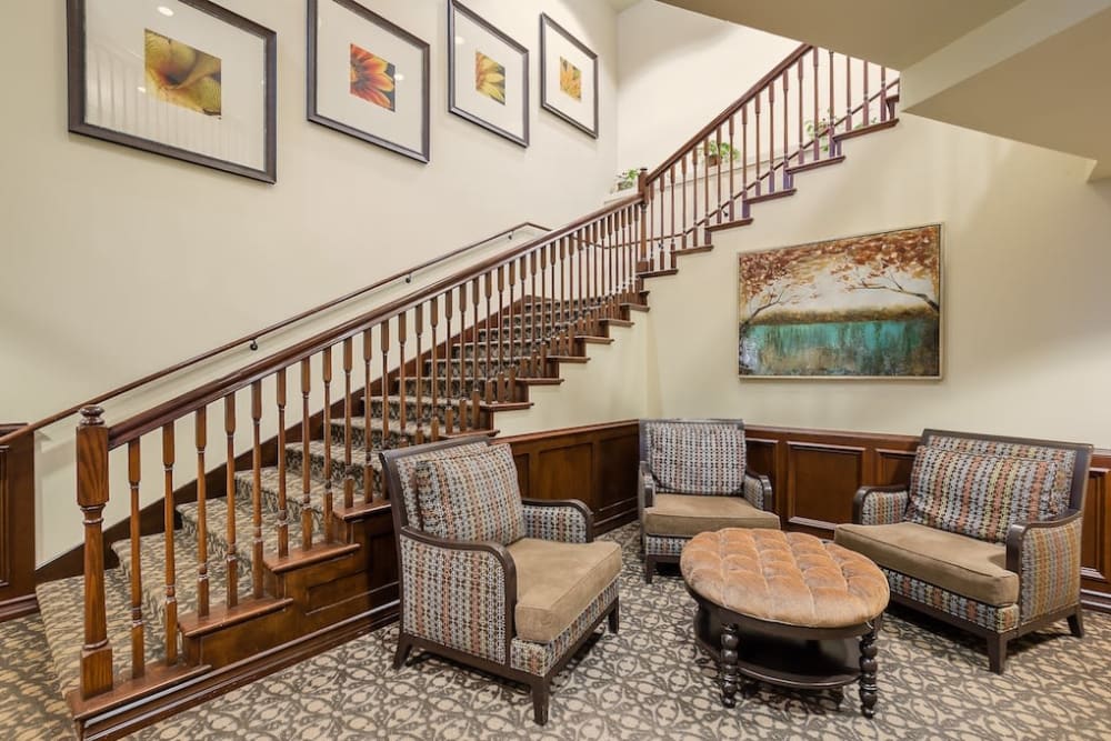 Staircase and seating area at Pacifica Senior Living Country Crest in Oroville, California