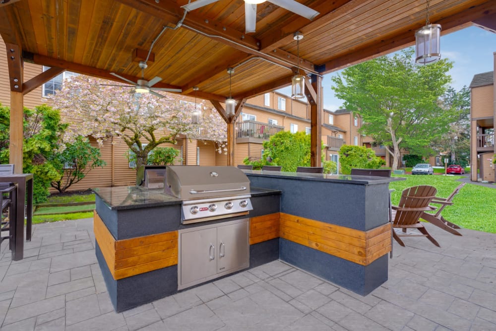 Covered grill and fire pit area at Renaissance at 29th Apartments in Vancouver, Washington