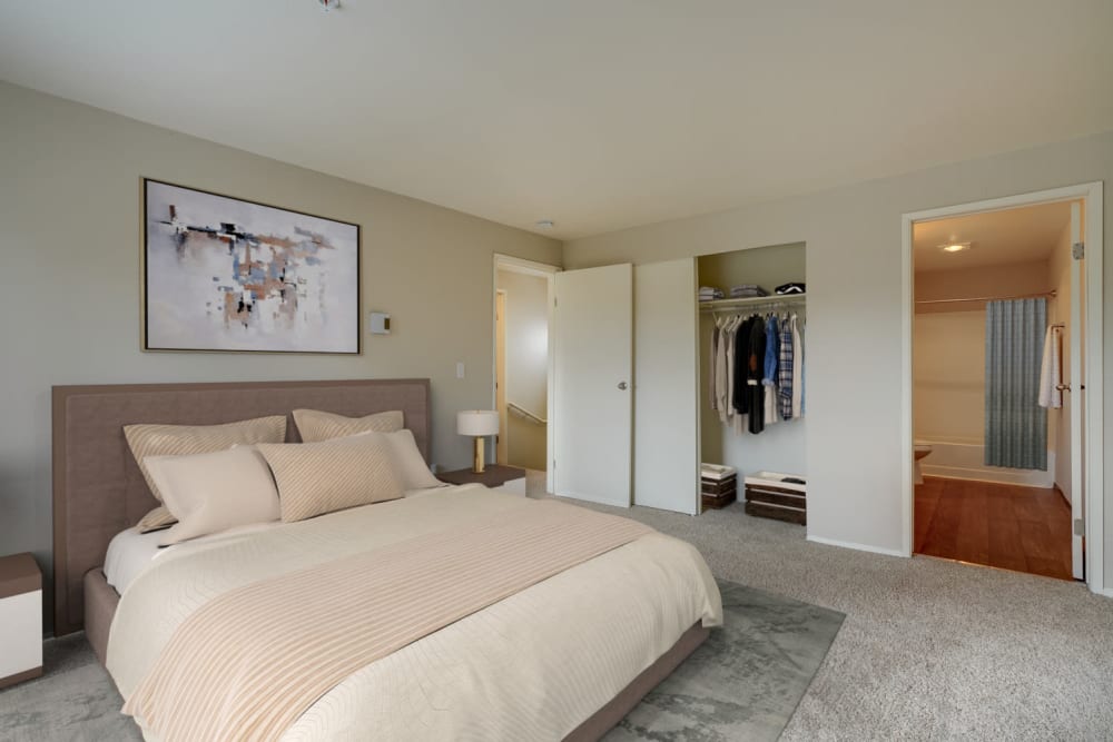 Decorated master bedroom with a large closet at Renaissance at 29th Apartments in Vancouver, Washington