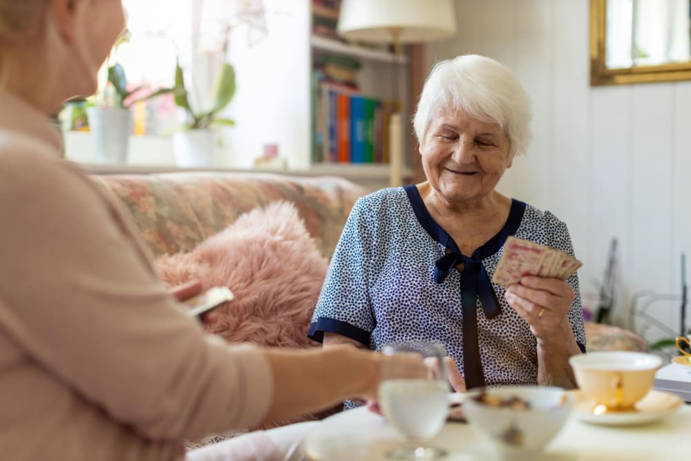 Resident and caregiver dining together Lake Park Senior Living in Oakland, California