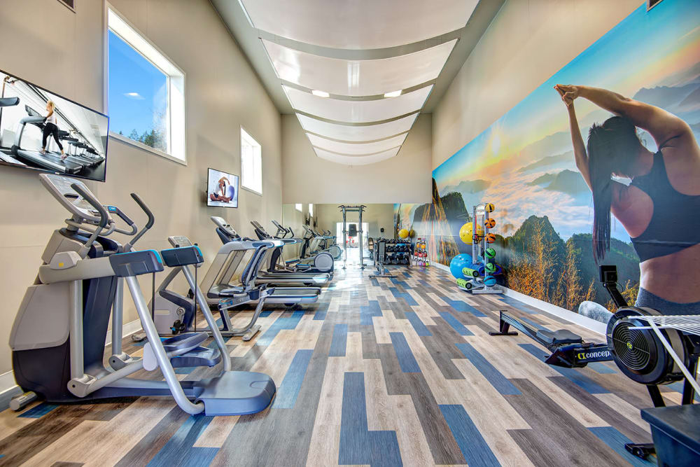 The fully equipped fitness center at Wellington Apartment Homes in Silverdale, Washington