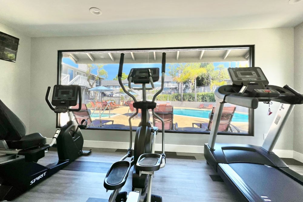 Fitness center with plenty of individual workout stations at Hillside Terrace Apartments in Lemon Grove, California