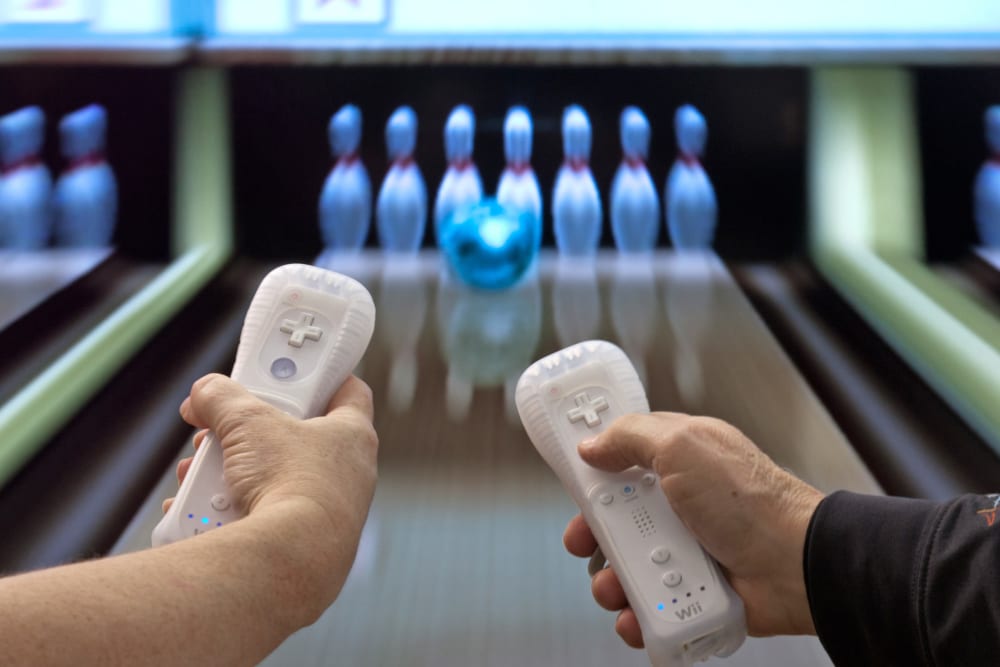 Senior living activities include Wii bowling at Carriage Inn Lake Jackson in Lake Jackson, Texas