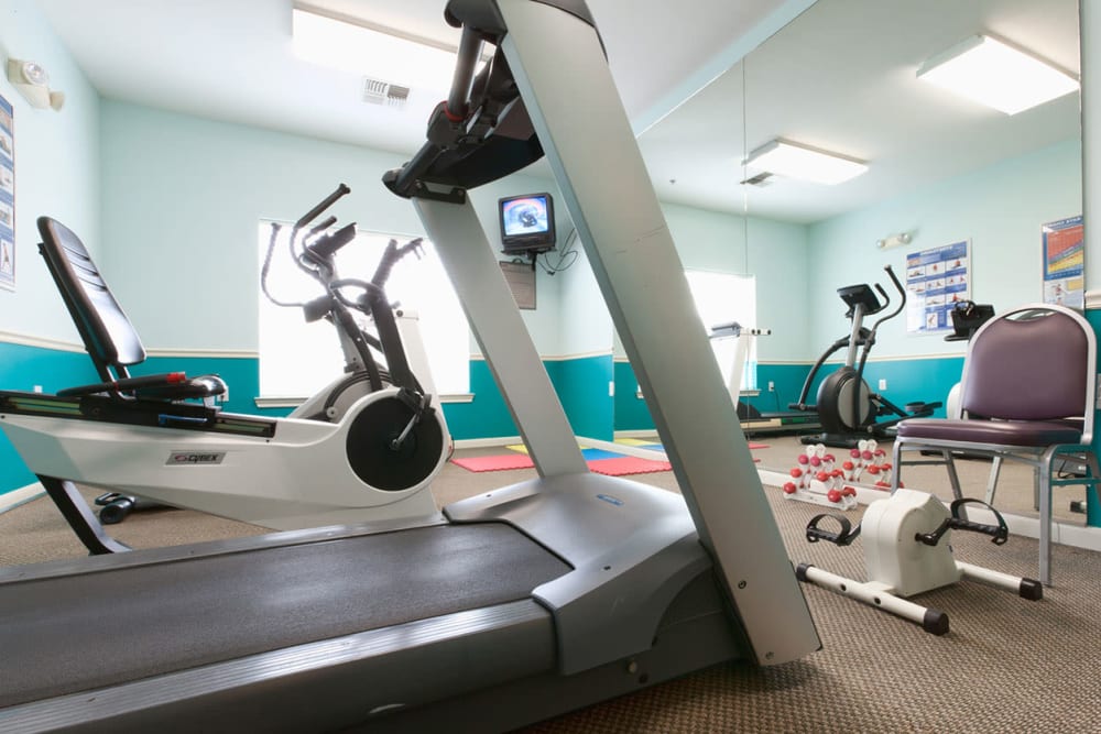 Exercise equipment in the gym at Village on the Park Steeplechase in Houston, Texas