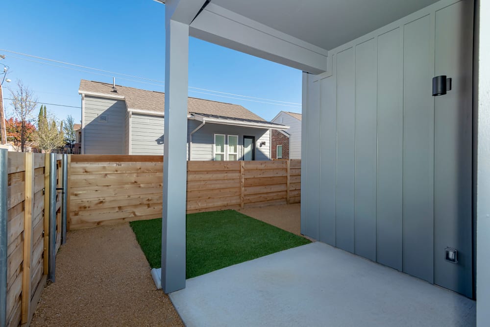 Private patio and grass area in your yard at parcHAUS AT CELINA PARKWAY in Celina, Texas