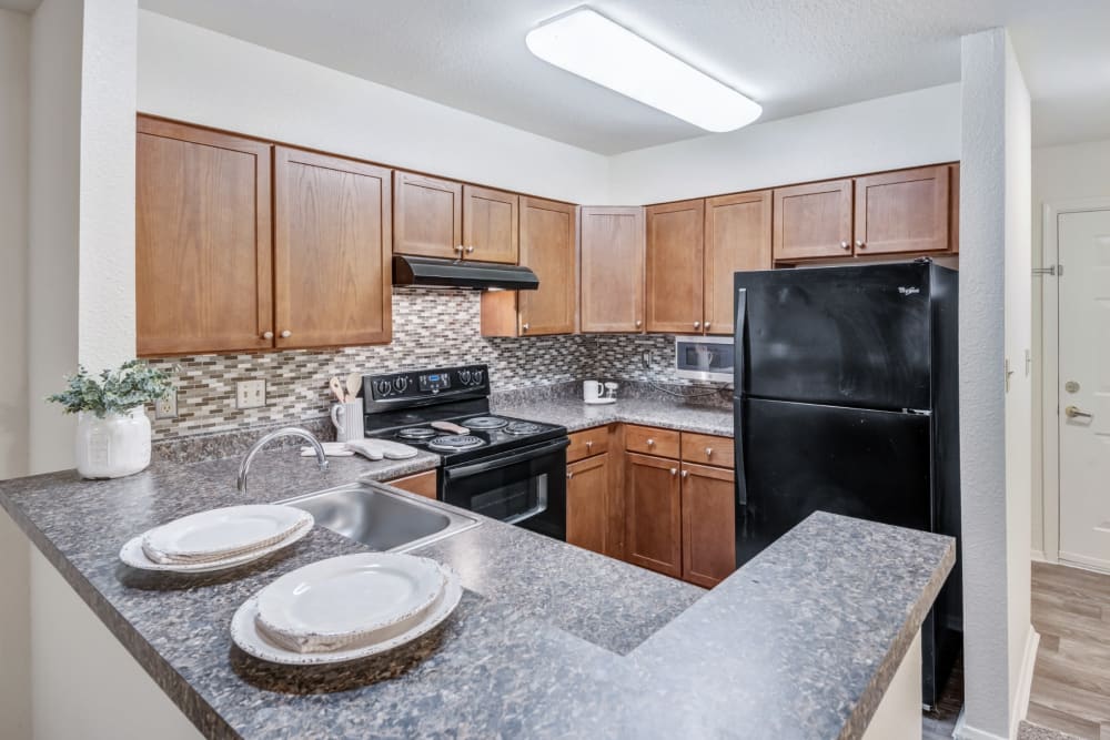 Kitchen with a breakfast bar at St. Mary's Landing Apartments & Townhomes in Lexington Park, Maryland