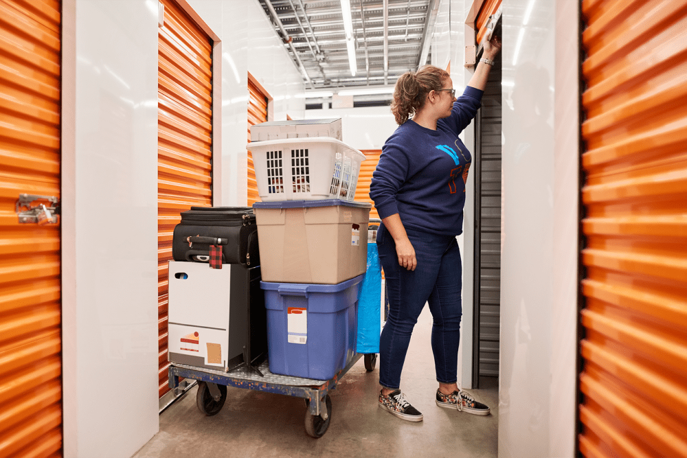 A customer moving items to their unit at BuxBear Storage Hayden in Hayden, Idaho